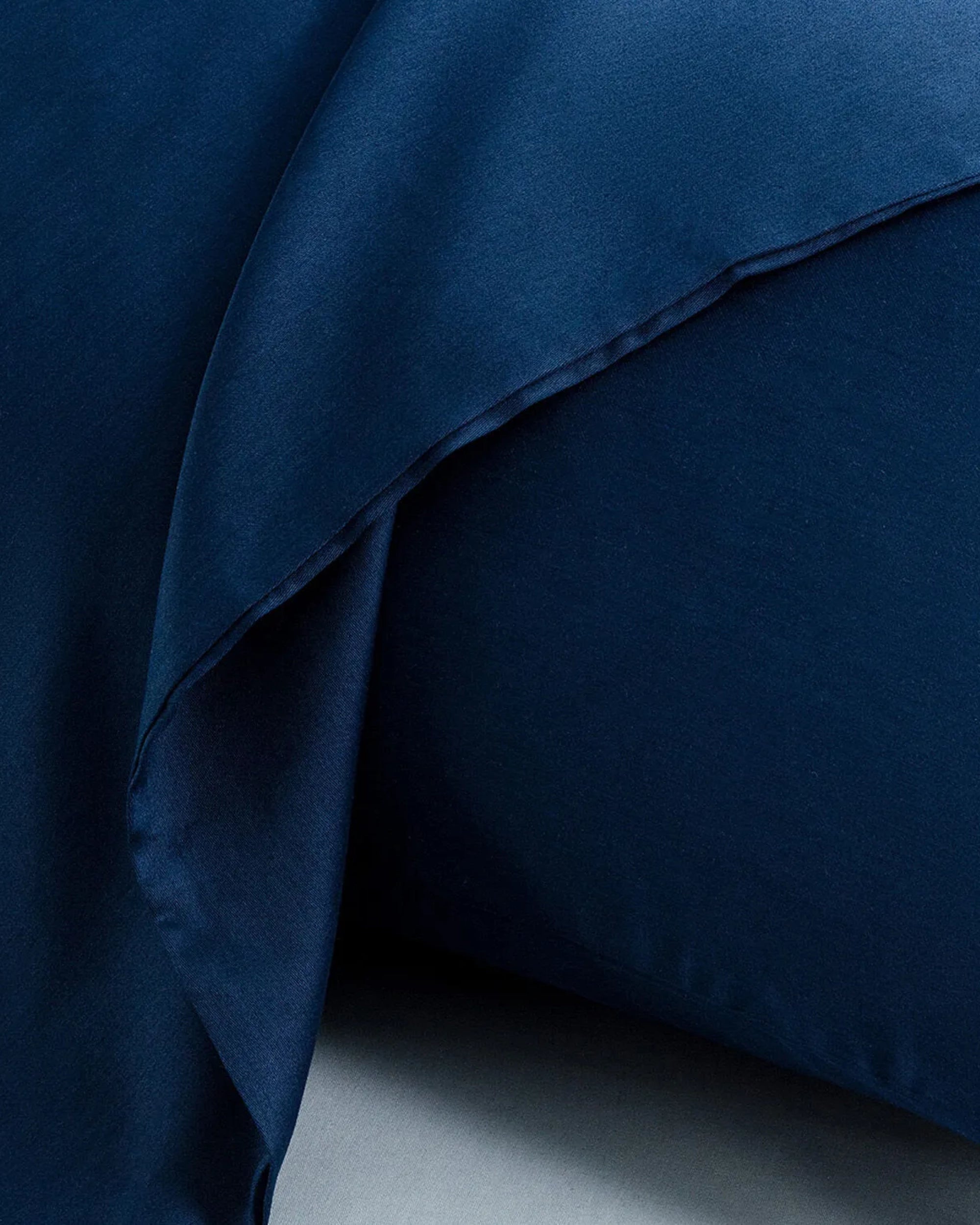 Midnight Blue satin pillowcase with silky texture and sophisticated bedroom style.