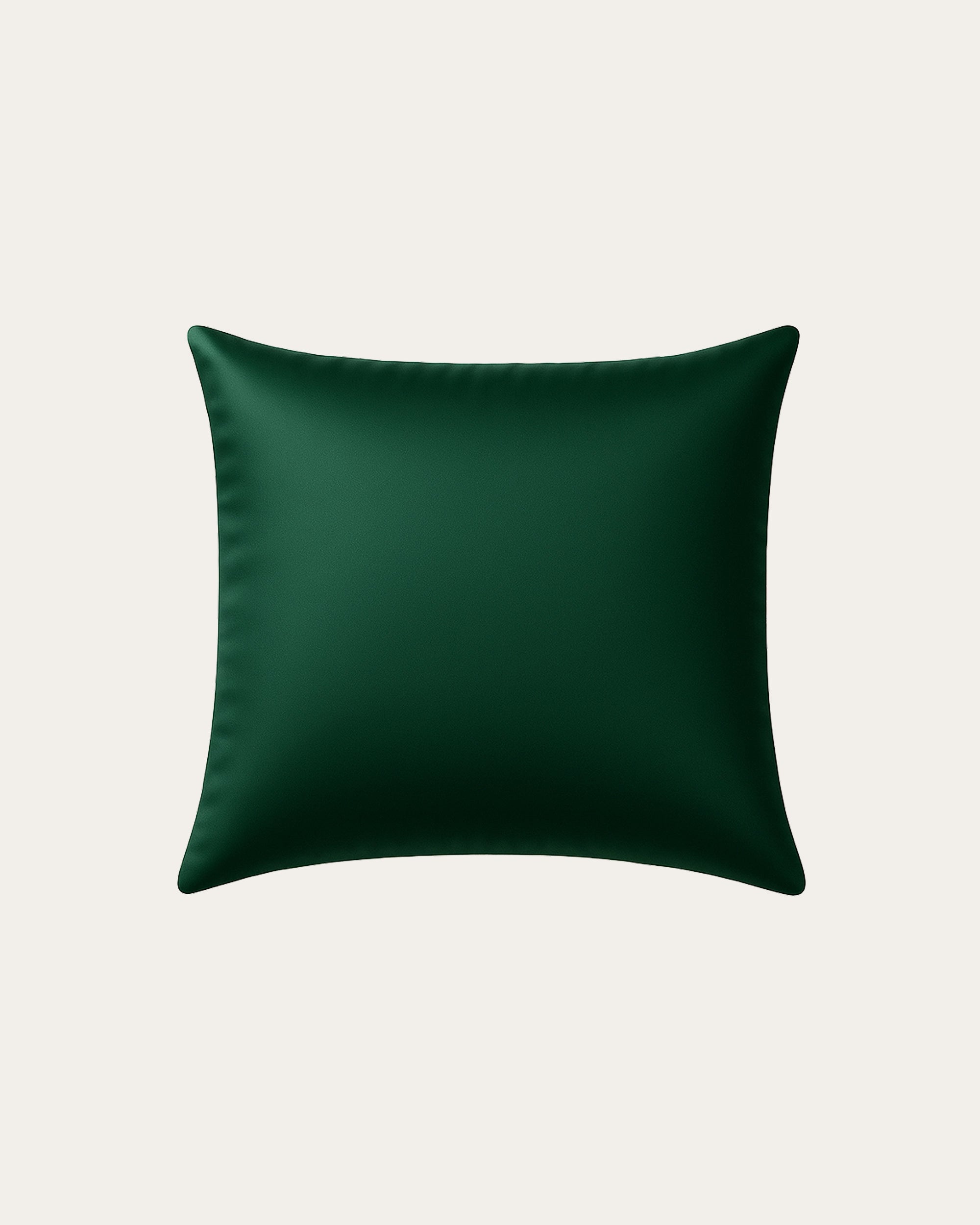 Green satin square pillowcase, smooth texture reducing friction for hair and skin care.