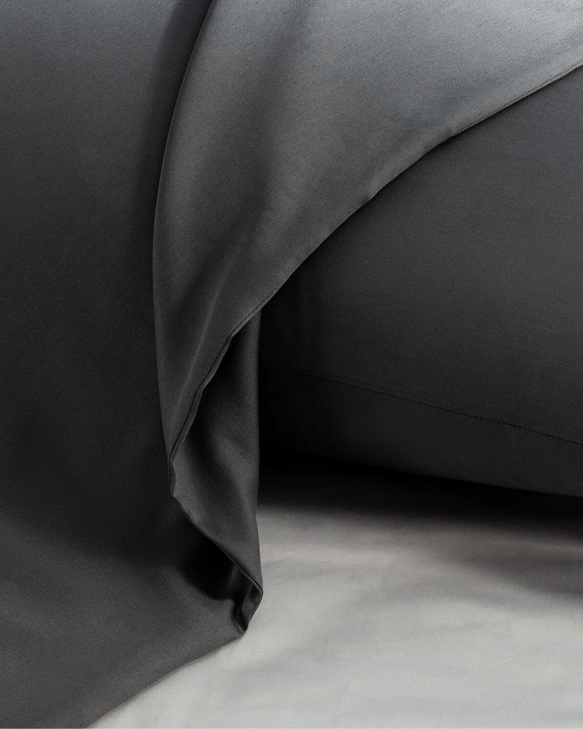 Elegant Oxford pillowcase in moonlight silver satin, designed to enhance restful sleep while adding a chic and timeless accent to your bedding.
