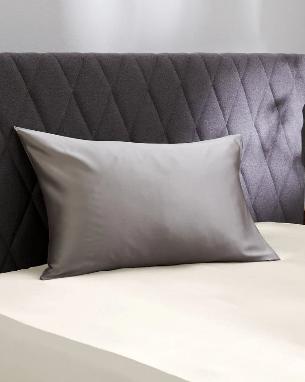 Close-up of Moonlight Silver Pillowcase showcasing its silky texture and romantic charm for a fresh morning look.