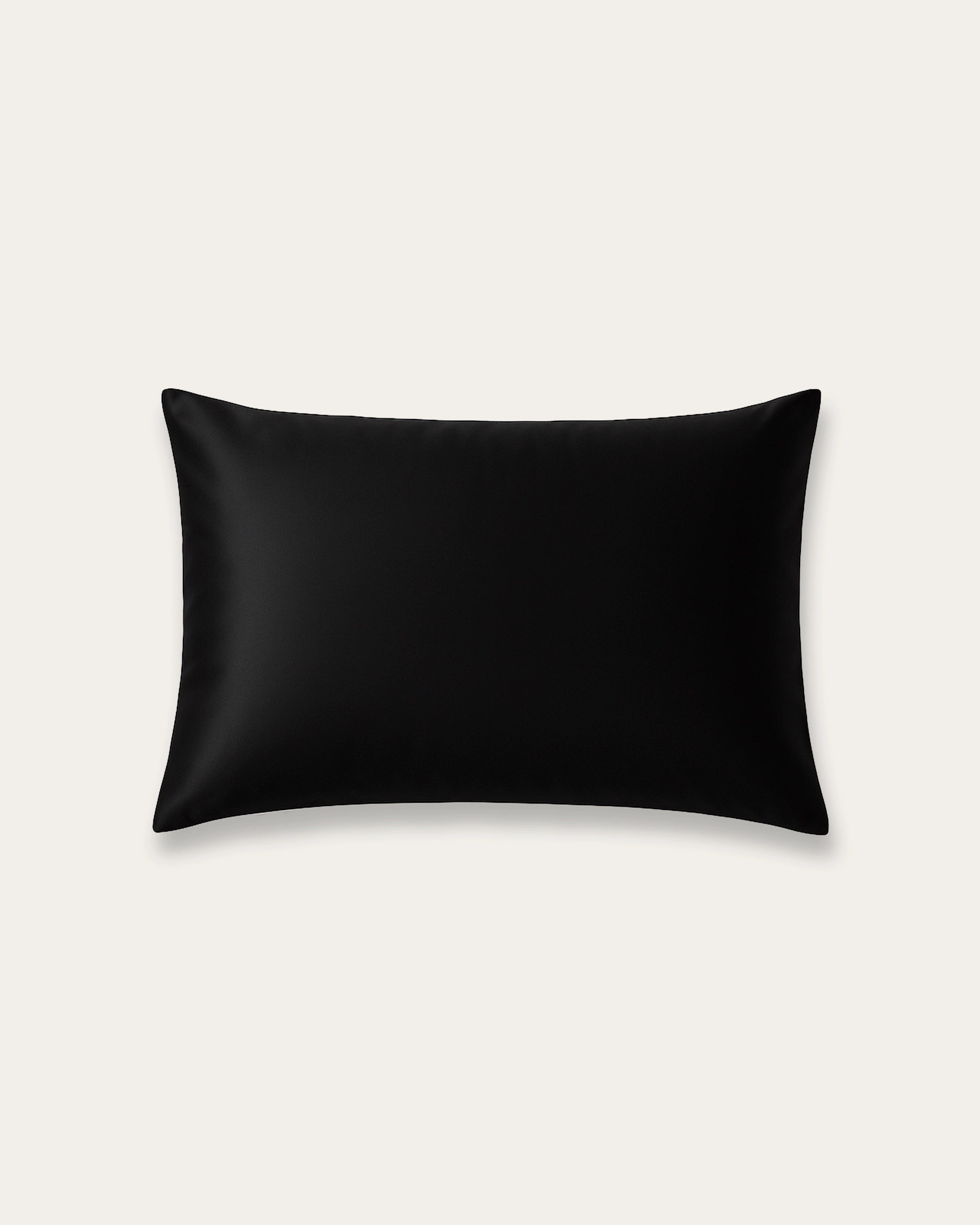 Sleek black velour satin pillowcase, perfect for enhancing elegance and preventing hair breakage.
